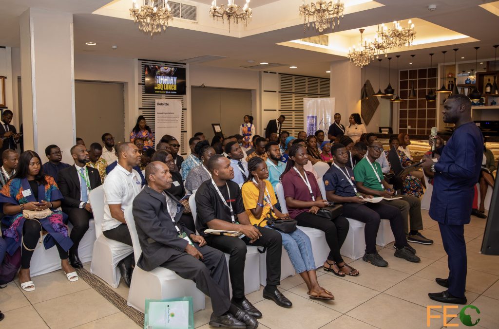 Candid moment of participants listening to the host at the 2025 FEC side events.